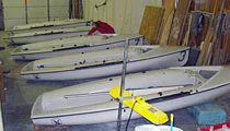 Row of small dinghies in the shop
